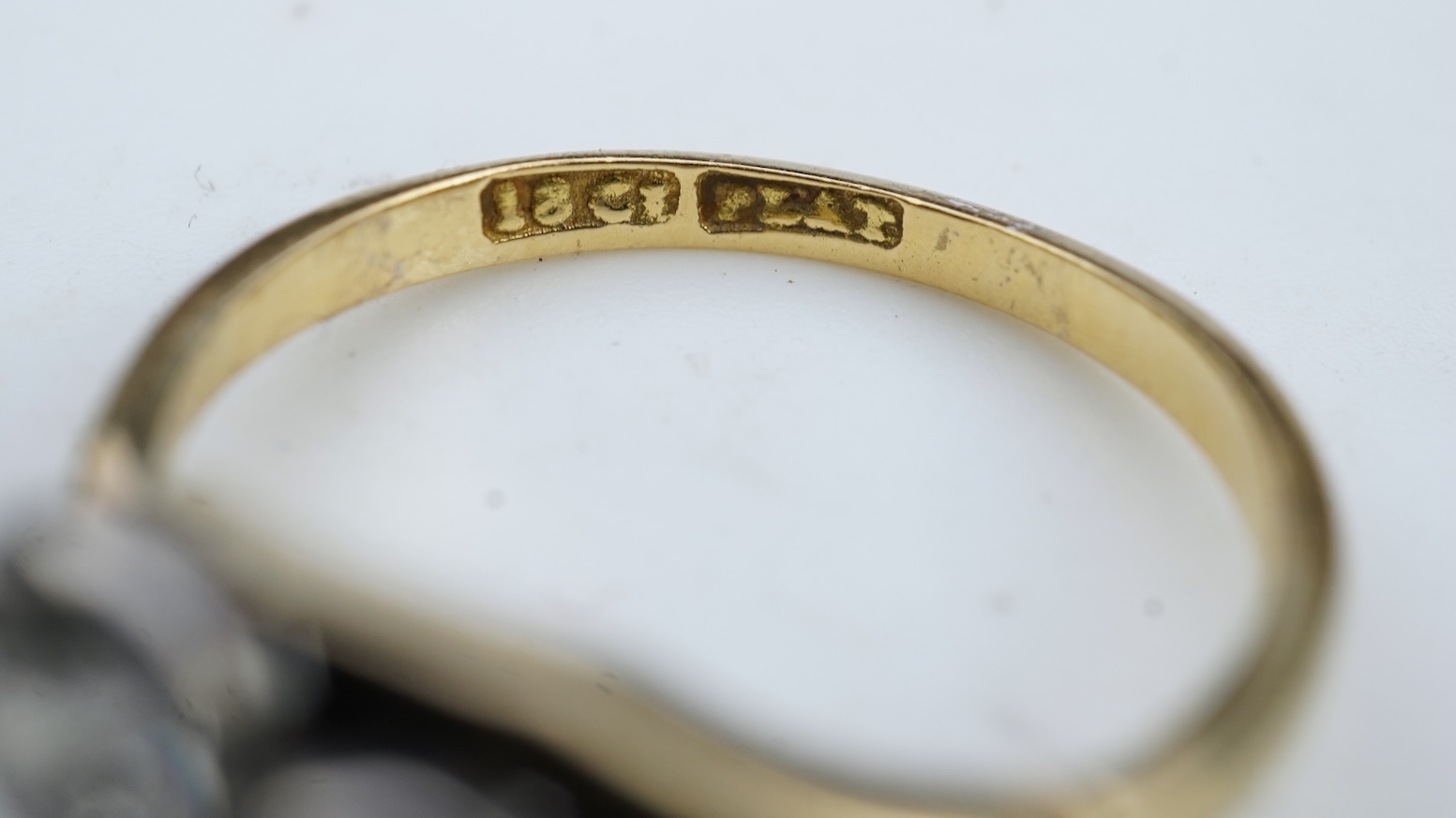 A three-stone diamond ring, early 20th century